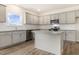 Modern kitchen with granite countertops, center island, and stainless steel appliances at 104 Pisgah St, Sanford, NC 27330