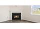 Bright living room with luxury vinyl plank flooring and a cozy corner fireplace at 104 Pisgah St, Sanford, NC 27330