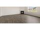 Cozy living room featuring a fireplace, neutral walls, a window, and wood-look flooring at 104 Pisgah St, Sanford, NC 27330