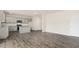 Open concept living space with wood floors flowing into modern kitchen area at 104 Pisgah St, Sanford, NC 27330