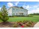 Large two-story home with manicured lawn and colorful flower beds at 104 Siebold St, Garner, NC 27529