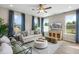 Comfortable living room featuring a plush sofa, stylish decor, and natural light at 104 Siebold St, Garner, NC 27529