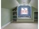 Attic space with built-in bookshelves and a window seat, perfect for a cozy reading nook at 105 John St, Louisburg, NC 27549