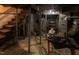 Unfinished basement with utilities and a stairway at 105 John St, Louisburg, NC 27549