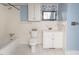Bathroom with white tile, a vanity, and a shower-tub combo at 105 John St, Louisburg, NC 27549