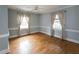 Empty bedroom with wood floors, crown moulding, and neutral walls at 105 John St, Louisburg, NC 27549