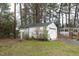 View of the garage, gazebo and greenhouse, highlighting outdoor amenities at 105 John St, Louisburg, NC 27549