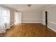 Spacious living room with hardwood floors, neutral walls and natural lighting at 105 John St, Louisburg, NC 27549