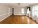 Bright living room features hardwood floors, neutral walls, and natural light at 105 John St, Louisburg, NC 27549