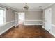 Warm and inviting living room with hardwood floors and open doorways at 105 John St, Louisburg, NC 27549