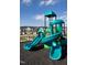 Close up of community playground featuring bright teal slides and climbing structures near residential homes at 112 Siebold St, Garner, NC 27529