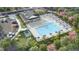 Aerial shot of the community pool with lounge chairs, playground, parking, and green spaces at 116 Siebold St, Garner, NC 27529