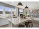 Open kitchen with granite island, stainless appliances and view of dining area at 116 Siebold St, Garner, NC 27529