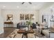 Comfortable living room with modern decor, stylish rug, and a gray sofa at 116 Siebold St, Garner, NC 27529