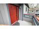 A red front door framed by grey trim and siding creates an inviting entrance to the home at 12 Melstone Turn, Durham, NC 27707