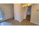Bright hallway with access to rooms and natural light from the door leading outside at 12 Melstone Turn, Durham, NC 27707