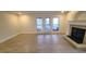 The open-concept living area features a fireplace and patio access for seamless indoor-outdoor living at 12 Melstone Turn, Durham, NC 27707