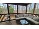 Relaxing screened porch with comfortable seating and wooded views at 12 Melstone Turn, Durham, NC 27707