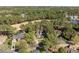 A home nestled in a mature landscape offers a tranquil setting and a beautiful view of the surrounding neighborhood at 1321 Colonial Club Rd, Wake Forest, NC 27587