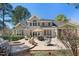 Inviting backyard patio with seating, fire pit, and well-maintained landscaping perfect for entertaining at 1321 Colonial Club Rd, Wake Forest, NC 27587