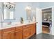 Bathroom features double sinks, wood cabinets, and access to the Primary bedroom at 1321 Colonial Club Rd, Wake Forest, NC 27587