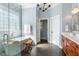 Bathroom featuring walk-in shower, soaking tub, dual vanities, and modern fixtures at 1321 Colonial Club Rd, Wake Forest, NC 27587