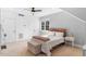 Bright bedroom with carpet flooring, a ceiling fan, and a double closet at 1321 Colonial Club Rd, Wake Forest, NC 27587