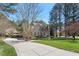 Attractive property featuring a spacious driveway and a well-maintained lawn at 1321 Colonial Club Rd, Wake Forest, NC 27587
