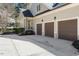 Spacious three-car garage offering ample parking and storage space with a paved driveway at 1321 Colonial Club Rd, Wake Forest, NC 27587