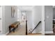 Hallway with wainscotting, bench seating, and carpeted stairs at 1321 Colonial Club Rd, Wake Forest, NC 27587