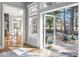 Bright living space with walls of windows leading to an outdoor patio at 1321 Colonial Club Rd, Wake Forest, NC 27587