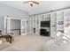 Spacious living room featuring built-in shelving and access to the stairway at 1321 Colonial Club Rd, Wake Forest, NC 27587