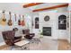 Cozy living room features hardwood floors, fireplace and leather chairs at 1321 Colonial Club Rd, Wake Forest, NC 27587