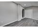 Basement featuring gray walls, wood-look flooring, and closet at 1323 Colon Rd, Sanford, NC 27330
