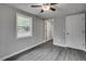 A bedroom featuring a ceiling fan, window and gray walls at 1323 Colon Rd, Sanford, NC 27330