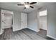 A bedroom featuring a ceiling fan and doorway to a bathroom at 1323 Colon Rd, Sanford, NC 27330
