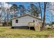 Exterior elevation features gray siding, a small deck, and stairs at 1323 Colon Rd, Sanford, NC 27330