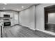 Bright kitchen featuring white cabinets, stainless steel appliances, gray walls and light gray wood-look flooring at 1323 Colon Rd, Sanford, NC 27330