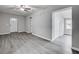 Living room featuring sleek, gray flooring and neutral paint, creating a modern feel at 1323 Colon Rd, Sanford, NC 27330
