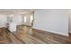 Open-concept living space with a chandelier, access to the staircase, and light-colored walls at 1573 Piney Falls Dr, Wendell, NC 27591