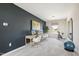 Bright bedroom featuring a dual workstation desk area and a fitness space with exercise equipment at 209 E American Marigold Dr # 44, Benson, NC 27504