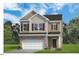 Charming two-story home featuring a two-car garage and neutral color palette at 209 E American Marigold Dr # 44, Benson, NC 27504