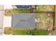 Aerial shot of house highlighting the roof, backyard with wooden deck, and fenced yard space at 215 Seventh St, Wake Forest, NC 27587