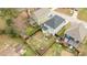 Aerial view of the fenced in backyards with play area and patios; houses in close proximity at 215 Seventh St, Wake Forest, NC 27587