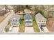 Overhead shot of homes in a neighborhood highlighting the cozy yards, driveways, and mature trees at 215 Seventh St, Wake Forest, NC 27587