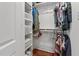 Organized closet with shelving and hanging space for clothes and accessories on a hardwood floor at 215 Seventh St, Wake Forest, NC 27587