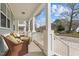 Inviting front porch featuring wicker seating and a view of the peaceful neighborhood at 215 Seventh St, Wake Forest, NC 27587