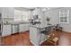 Modern kitchen featuring granite countertops, stainless steel appliances, and ample counter space at 215 Seventh St, Wake Forest, NC 27587