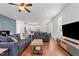 Bright, open living room with hardwood floors, comfortable seating, and easy access to the kitchen area at 215 Seventh St, Wake Forest, NC 27587
