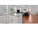 Open-concept living room visible from the kitchen with plenty of natural light at 215 Seventh St, Wake Forest, NC 27587
